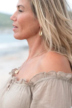Boucle d'oreille coquillage brillant or