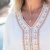 Collier en coquillage doré